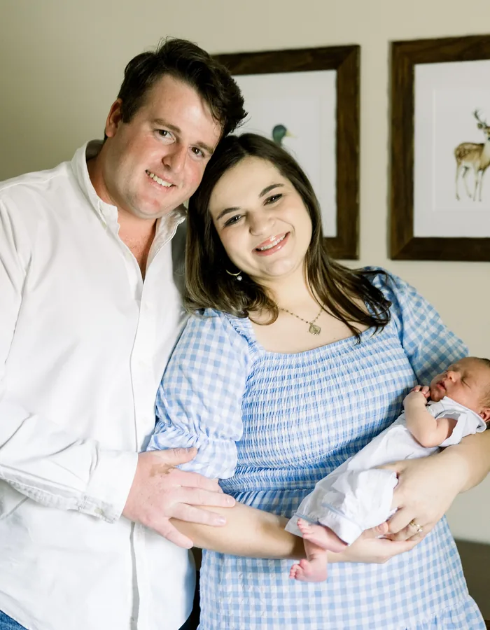 Dr. Hannah Butler with her husband and newborn baby