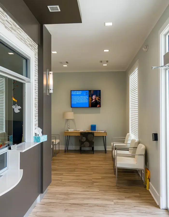Front desk check in window and the hallway leading to the waiting area at Hope Therapy Center