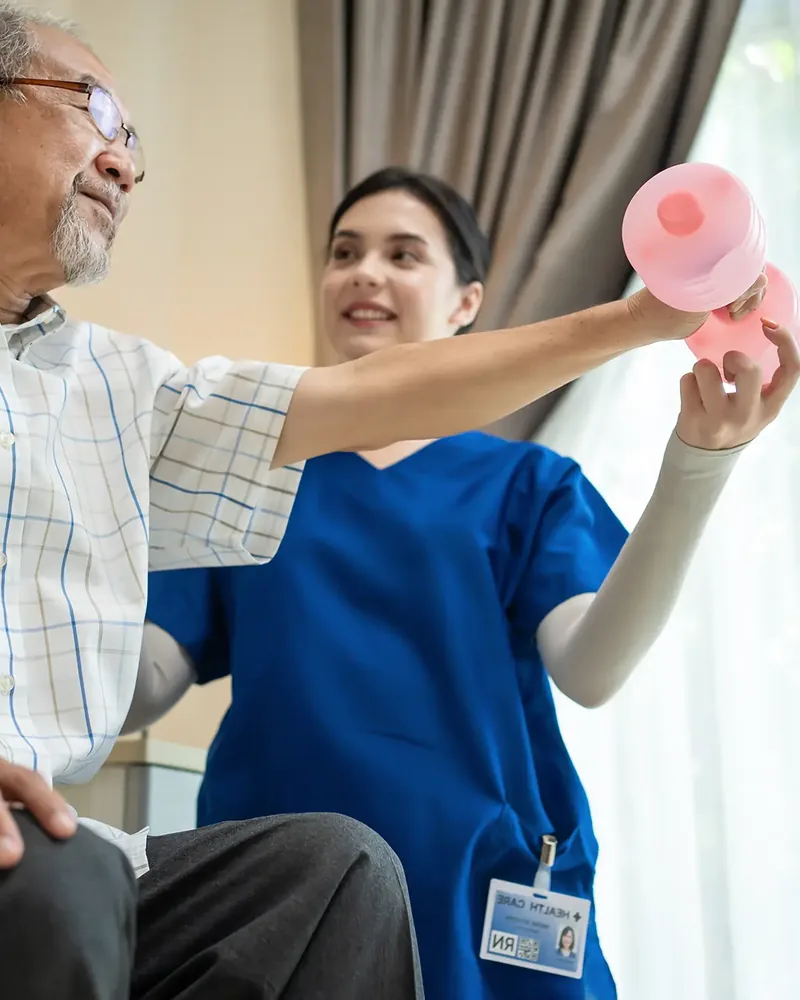 Therapist guiding a patient through a standing balance exercise at Hope Therapy Center