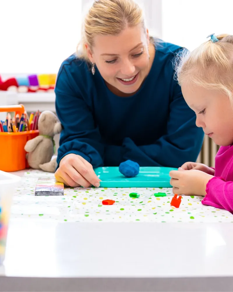 Therapist engaging a young patient in play-based therapy at Hope Therapy Center