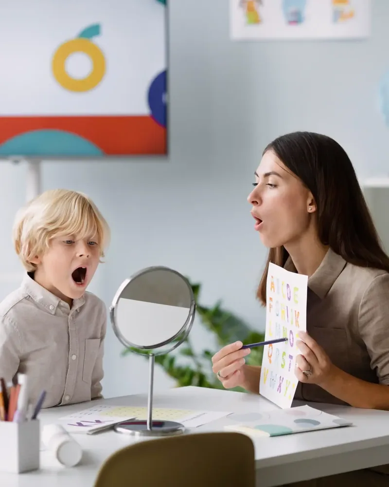 Speech-language pathologist working with a young patient at Hope Therapy Center