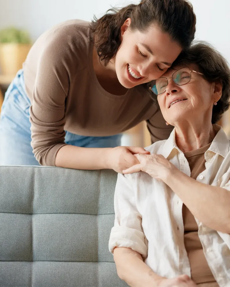 A caregiver comforting a patient at Hope Therapy Center