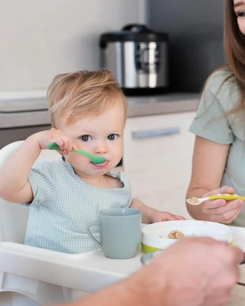 Feeding therapist supporting a parent and baby during a feed at Hope Therapy Center in Lake Charles