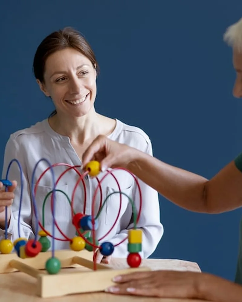 Occupational therapist working on hand skills with a child at Hope Therapy Center in Lake Charles