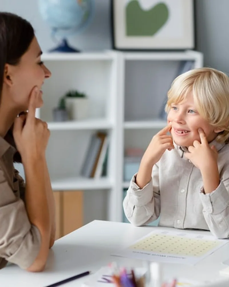 Speech-language pathologist working on speech sounds with a child at Hope Therapy Center in Lake Charles